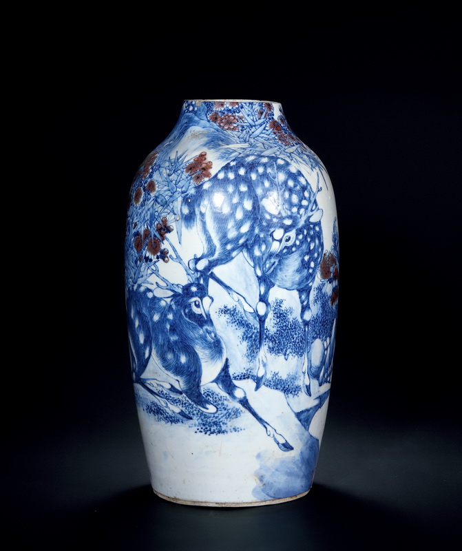Qianlong Period, Qing Dynasty A BLUE AND WHITE UNDERGLAZE COPPER-RED VASE WITH D